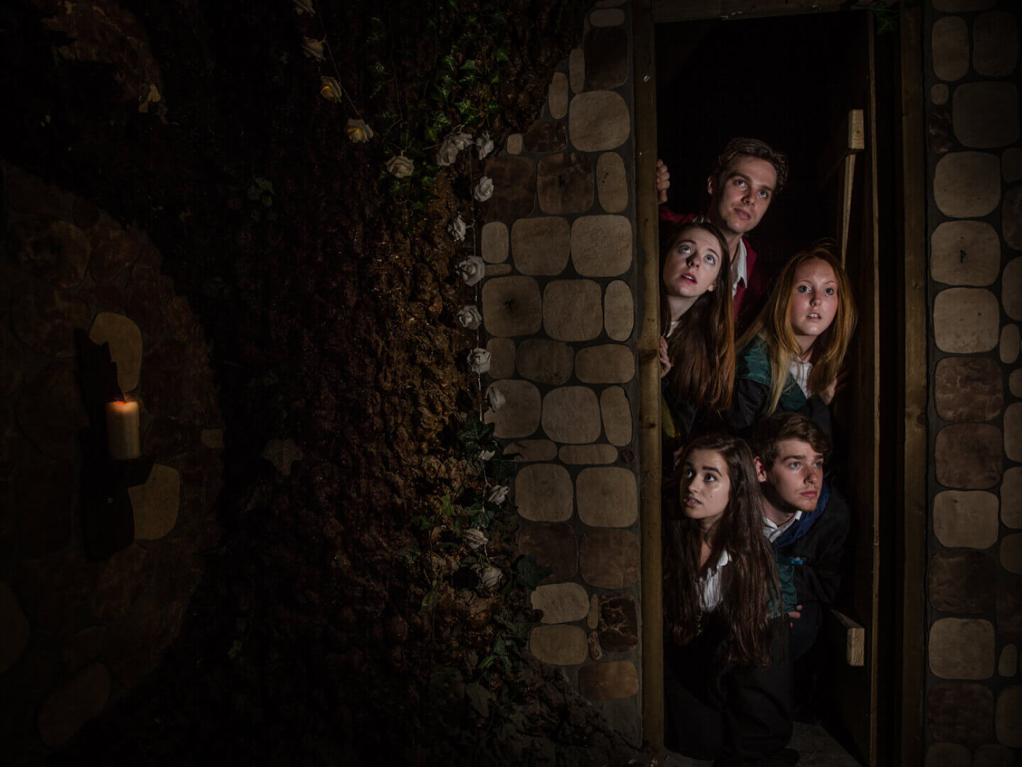 5 witches and wizards standing in a doorway