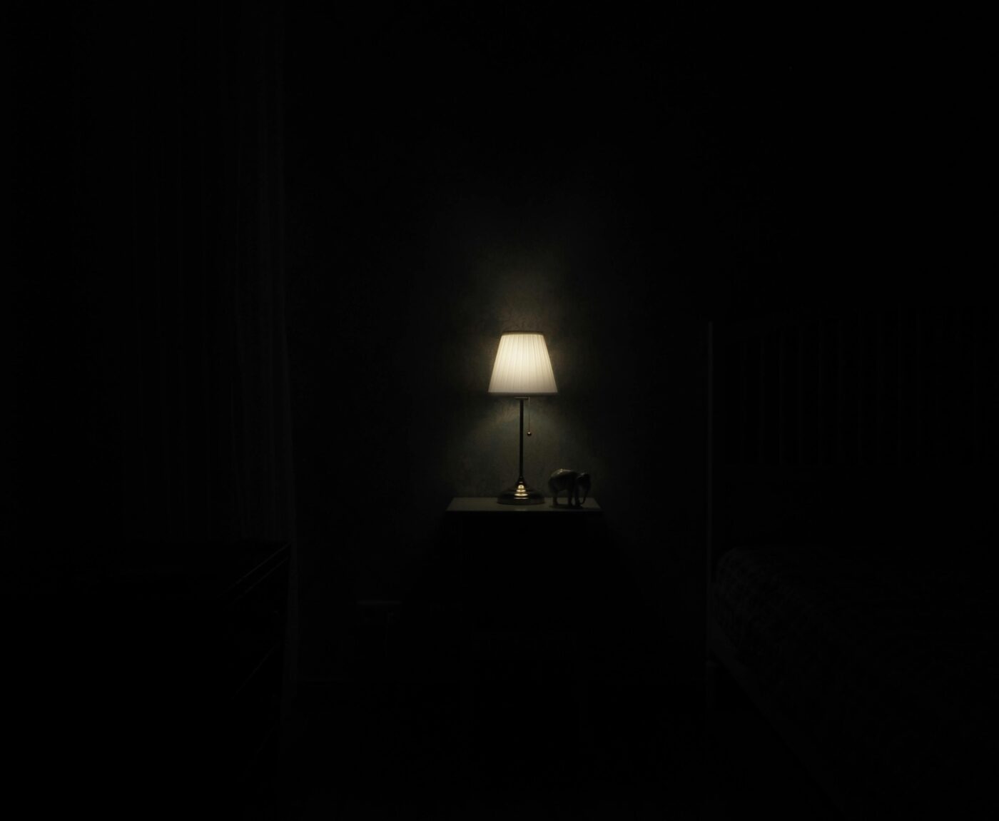 Single lamp within darkness