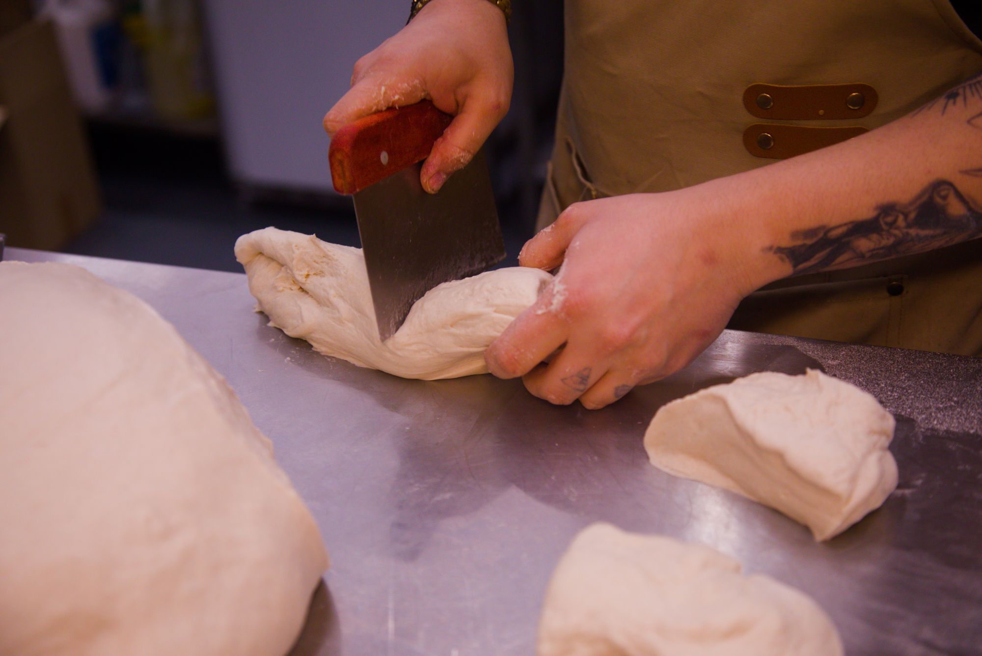 Cutting dough for pizza making