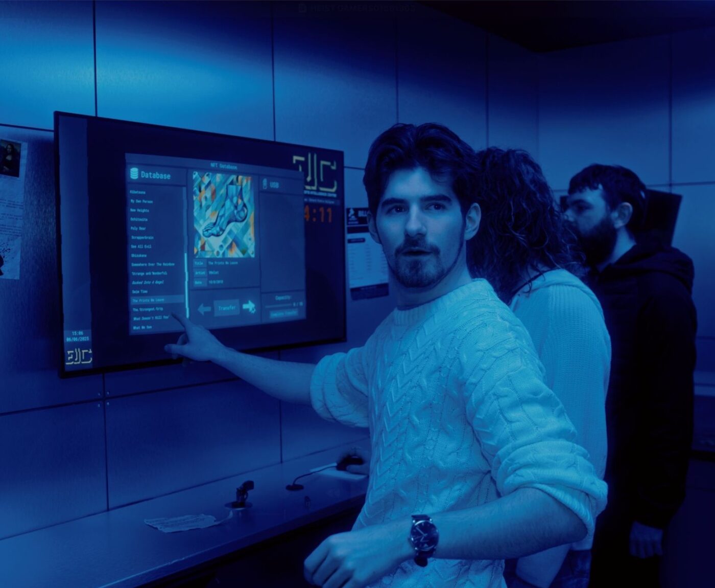 Group of people looking at information. Enigma Quests Escape Room The Billion Pound Heist